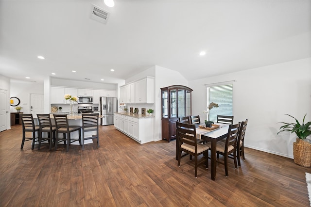 3313 Cold Swan Ct, Conroe, TX 77301 - dining room featuring dark wood finished floors, recessed lighting, and vaulted ceiling
