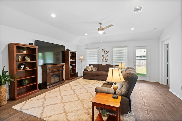 3313 Cold Swan Ct, Conroe, TX 77301 - living room with a ceiling fan, wood finished floors, a glass covered fireplace, recessed lighting, and baseboards