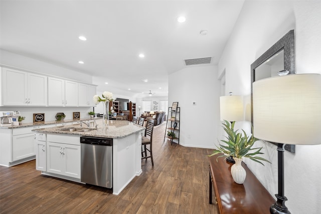 3313 Cold Swan Ct, Conroe, TX 77301 - kitchen featuring dishwasher, a sink, an island with sink, dark wood-type flooring, and white cabinetry