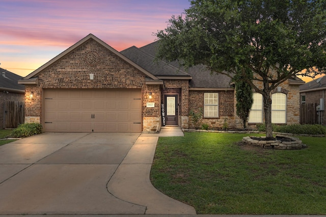 20423 Barrel Run Dr, Hockley, TX 77447 - view of front of house with brick siding, a shingled roof, driveway, an attached garage, and a front lawn