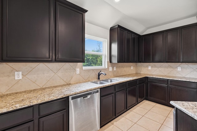 20423 Barrel Run Dr, Hockley, TX 77447 - kitchen with stainless steel dishwasher, a sink, light tile patterned flooring, backsplash, and lofted ceiling