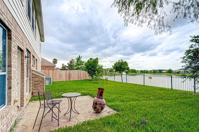 15131 Live Oak Bend Way, Cypress, TX 77429 - view of yard featuring a water view and a patio