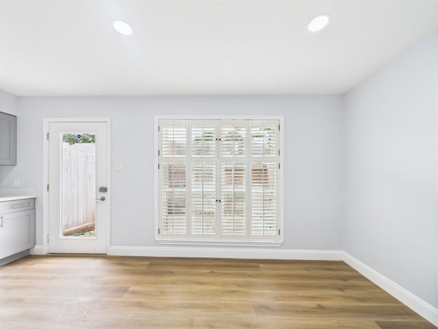 10380 Briar Forest Dr Unit 32/6, Houston, TX 77042 - unfurnished dining area featuring plenty of natural light, baseboards, light wood finished floors, and recessed lighting