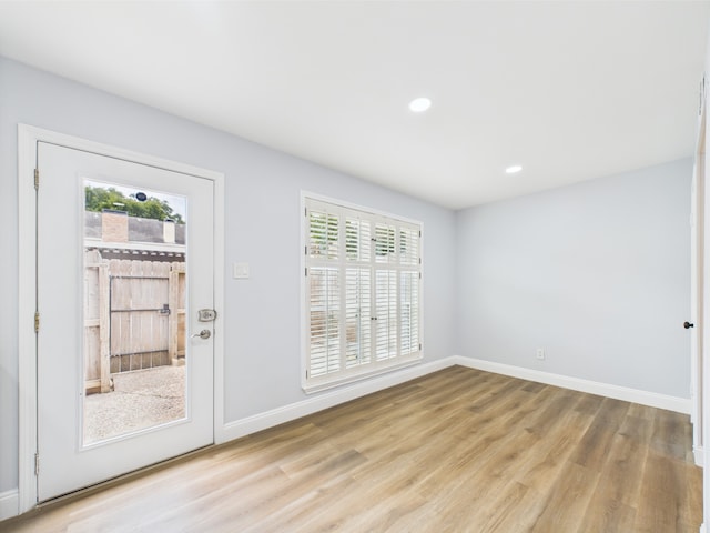 10380 Briar Forest Dr Unit 32/6, Houston, TX 77042 - doorway featuring healthy amount of natural light, light wood-type flooring, baseboards, and recessed lighting