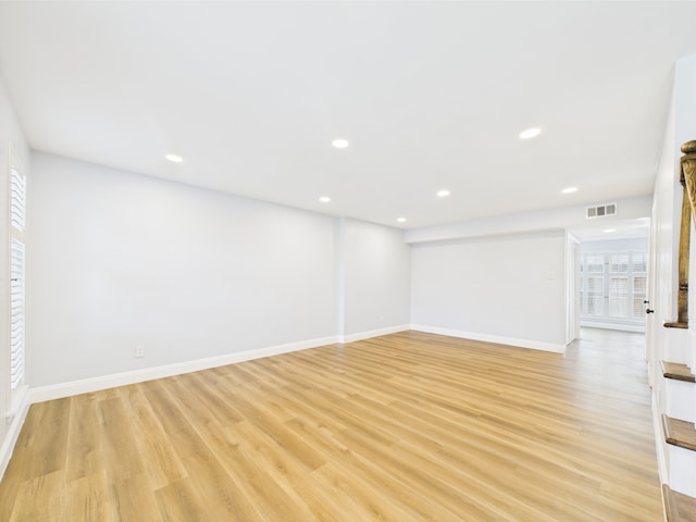 10380 Briar Forest Dr Unit 32/6, Houston, TX 77042 - unfurnished room featuring healthy amount of natural light, light wood-style flooring, recessed lighting, and baseboards