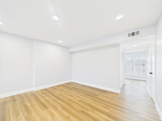 10380 Briar Forest Dr Unit 32/6, Houston, TX 77042 - unfurnished room with light wood finished floors, baseboards, and recessed lighting