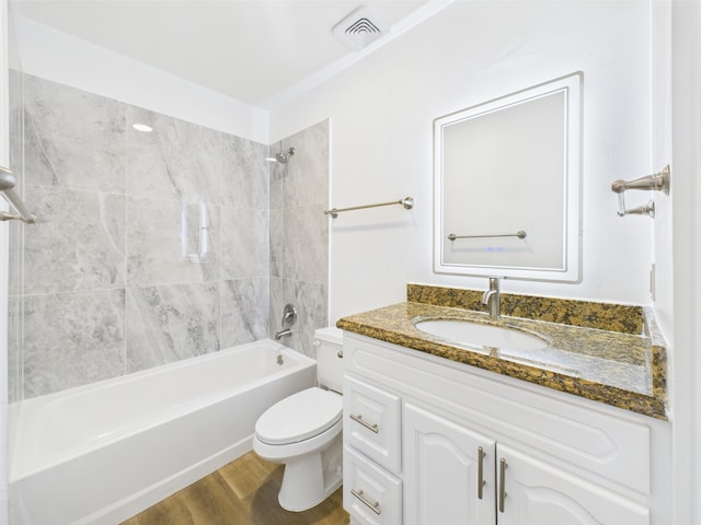 10380 Briar Forest Dr Unit 32/6, Houston, TX 77042 - bathroom featuring vanity, toilet, bathing tub / shower combination, and wood finished floors