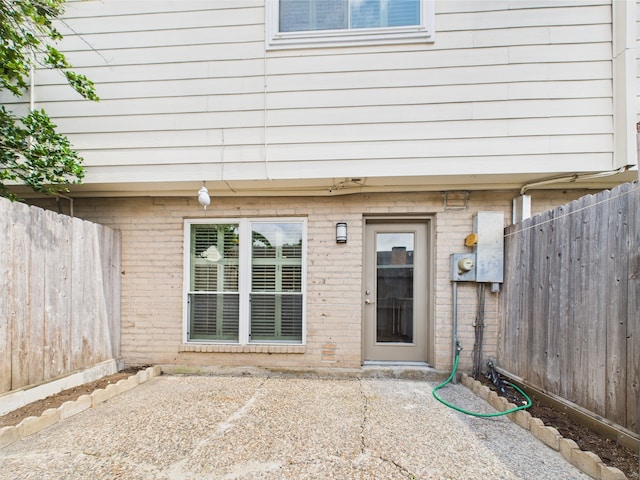 10380 Briar Forest Dr Unit 32/6, Houston, TX 77042 - entrance to property featuring brick siding and a patio