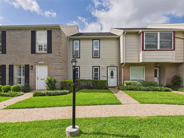 10380 Briar Forest Dr Unit 32/6, Houston, TX 77042 - view of property with a front yard and brick siding