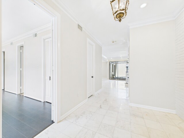 7608 Del Monte Dr, Houston, TX 77063 - hallway featuring crown molding, baseboards, marble finish floors, and recessed lighting