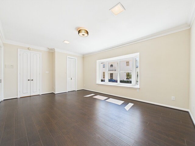 7608 Del Monte Dr, Houston, TX 77063 - unfurnished living room featuring ornamental molding, wood finished floors, and baseboards