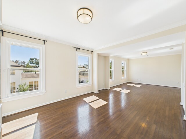 7608 Del Monte Dr, Houston, TX 77063 - unfurnished living room with ornamental molding, baseboards, and wood finished floors
