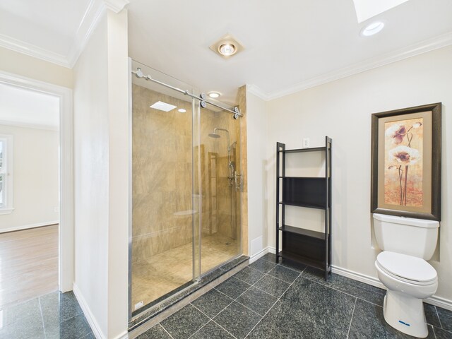 7608 Del Monte Dr, Houston, TX 77063 - full bath with granite tiled floors, baseboards, ornamental molding, a stall shower, and toilet
