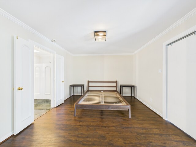 7608 Del Monte Dr, Houston, TX 77063 - bedroom featuring crown molding, wood finished floors, and baseboards
