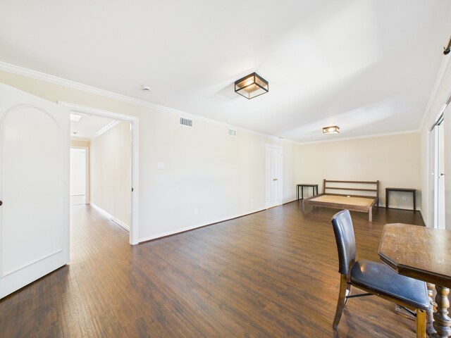 7608 Del Monte Dr, Houston, TX 77063 - dining space with dark wood-style floors, ornamental molding, and baseboards