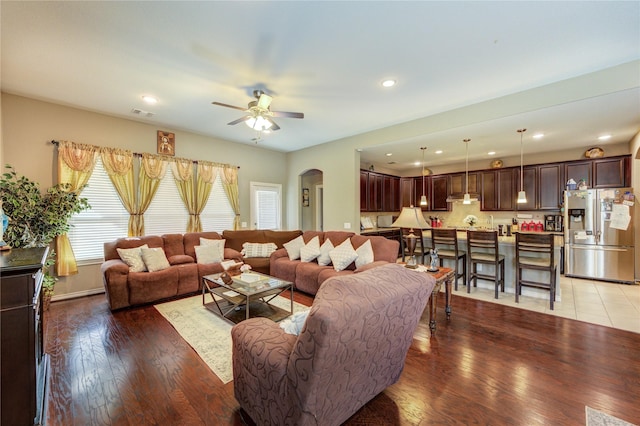 9710 Wild Orange Ct, Spring, TX 77379 - living room featuring arched walkways, ceiling fan, light wood finished floors, and recessed lighting