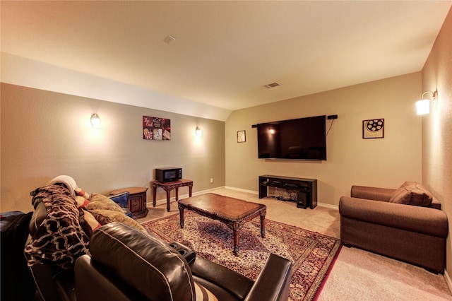 9710 Wild Orange Ct, Spring, TX 77379 - carpeted living area with vaulted ceiling, baseboards, and a wood stove
