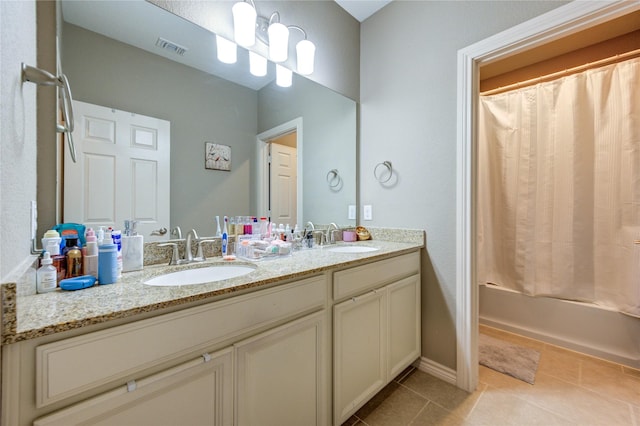 9710 Wild Orange Ct, Spring, TX 77379 - full bathroom featuring double vanity, tile patterned floors, and shower / tub combo with curtain