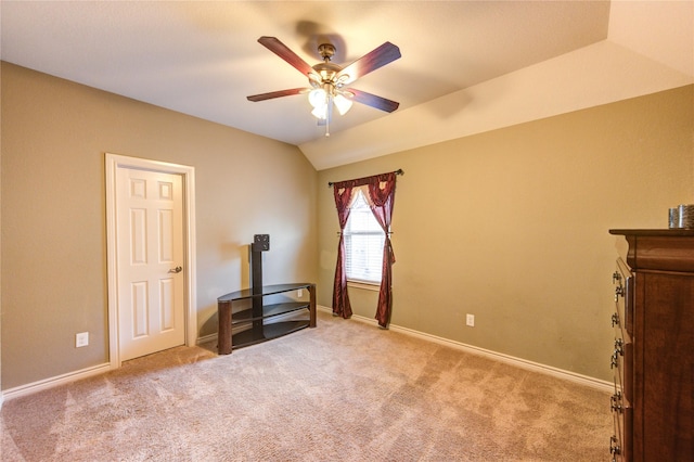 9710 Wild Orange Ct, Spring, TX 77379 - unfurnished bedroom featuring carpet flooring, baseboards, vaulted ceiling, and ceiling fan