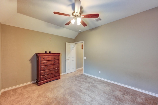 9710 Wild Orange Ct, Spring, TX 77379 - unfurnished bedroom featuring light carpet, baseboards, lofted ceiling, and a ceiling fan