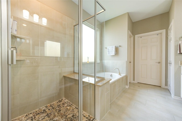 9710 Wild Orange Ct, Spring, TX 77379 - full bath with a bath, a stall shower, and tile patterned floors