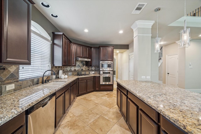 14603 Hampton Green Ln, Houston, TX 77044 - kitchen featuring appliances with stainless steel finishes, under cabinet range hood, a sink, backsplash, and dark brown cabinetry