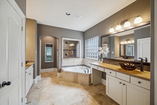 14603 Hampton Green Ln, Houston, TX 77044 - full bathroom with vanity, a garden tub, tiled shower, and baseboards