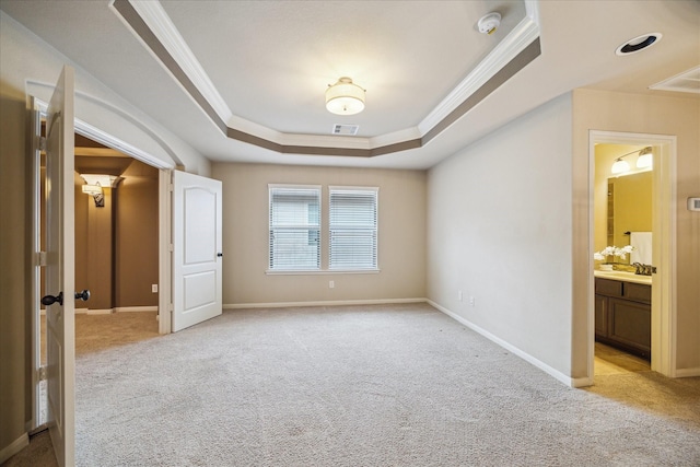 14603 Hampton Green Ln, Houston, TX 77044 - empty room featuring a tray ceiling, ornamental molding, light colored carpet, a smoke detector, and baseboards