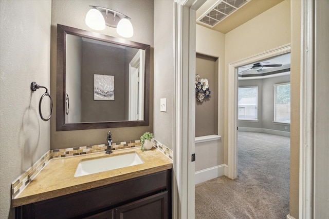 14603 Hampton Green Ln, Houston, TX 77044 - bathroom with vanity, baseboards, and ceiling fan