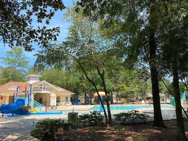 14603 Hampton Green Ln, Houston, TX 77044 - community pool with a water slide and view of scattered trees