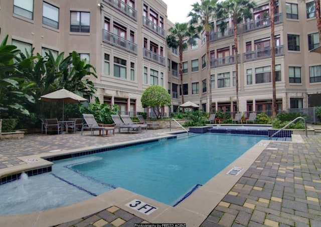 1901 Post Oak Blvd Unit 2215, Houston, TX 77056 - community pool featuring a patio area