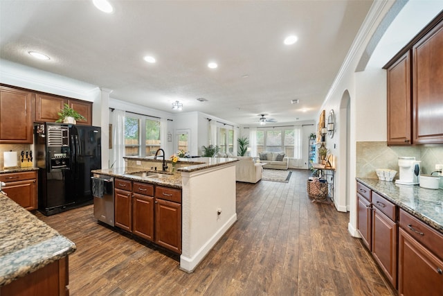 31318 Evergreen Park Ln, Conroe, TX 77385 - kitchen featuring a sink, black refrigerator with ice dispenser, ornamental molding, healthy amount of natural light, and dishwasher