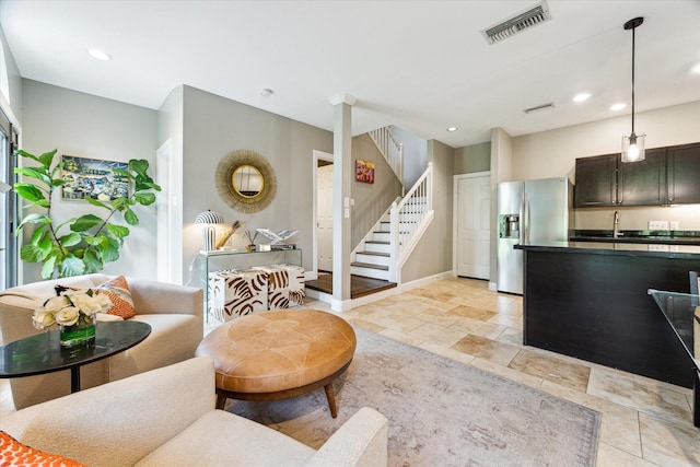 19 Crestwood Dr Unit 4, Houston, TX 77007 - living area with stairs, recessed lighting, baseboards, and light stone finish flooring