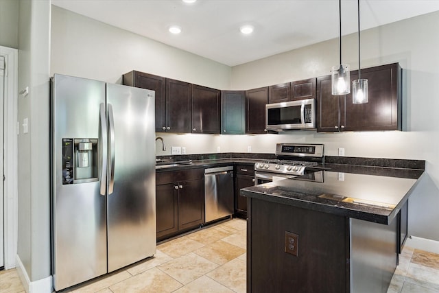 19 Crestwood Dr Unit 4, Houston, TX 77007 - kitchen featuring stainless steel appliances, dark countertops, a peninsula, a sink, and dark brown cabinets