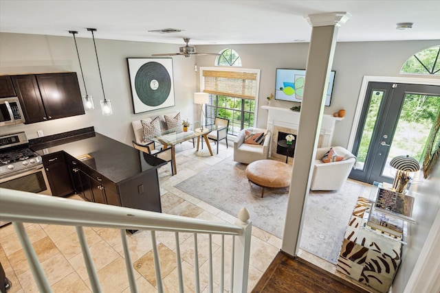 19 Crestwood Dr Unit 4, Houston, TX 77007 - living room featuring a fireplace and ceiling fan