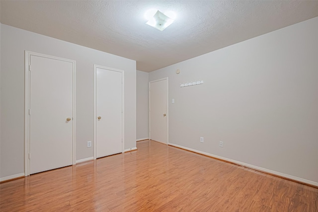 8143 Solara Bnd, Houston, TX 77083 - unfurnished bedroom featuring light wood-type flooring and baseboards
