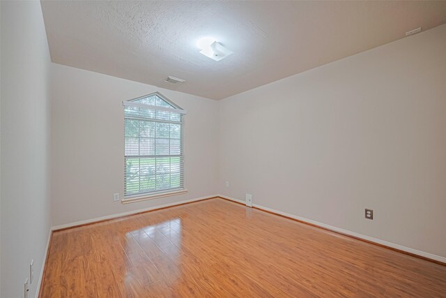 8143 Solara Bnd, Houston, TX 77083 - spare room featuring wood finished floors and baseboards