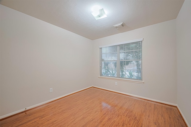 8143 Solara Bnd, Houston, TX 77083 - spare room featuring wood finished floors and baseboards