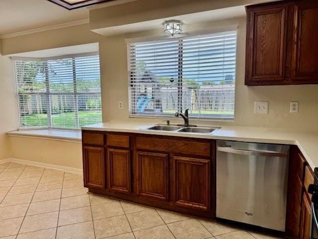 15326 Lindita Dr, Houston, TX 77083 - kitchen featuring stainless steel dishwasher, a sink, crown molding, light countertops, and light tile patterned flooring