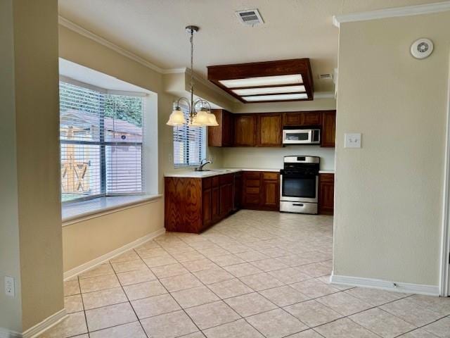 15326 Lindita Dr, Houston, TX 77083 - kitchen featuring gas range, white microwave, ornamental molding, light countertops, and plenty of natural light
