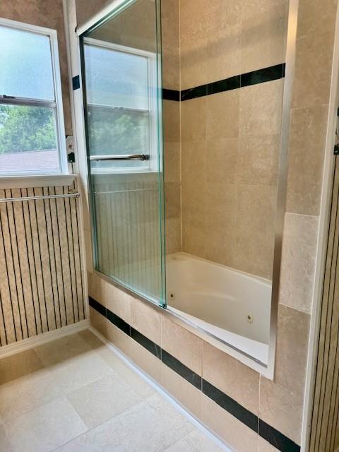 15326 Lindita Dr, Houston, TX 77083 - full bath with a combined bath / shower with jetted tub and tile patterned flooring