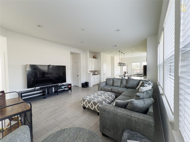 31334 Balsam Hawk Ln, Hockley, TX 77447 - living area with wood tiled floors and recessed lighting