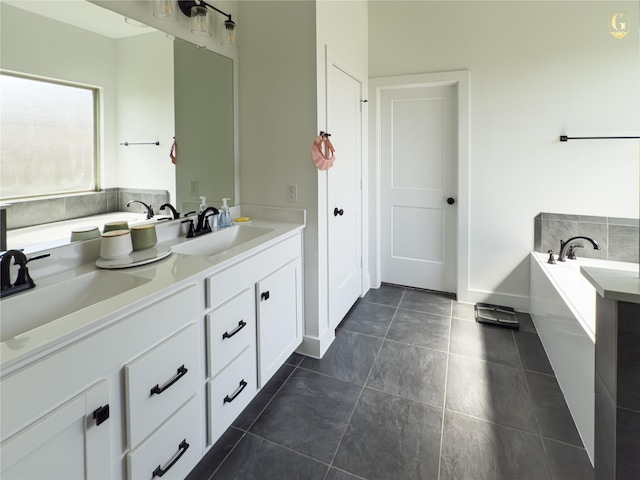 31334 Balsam Hawk Ln, Hockley, TX 77447 - full bathroom featuring a bath, double vanity, and tile patterned floors
