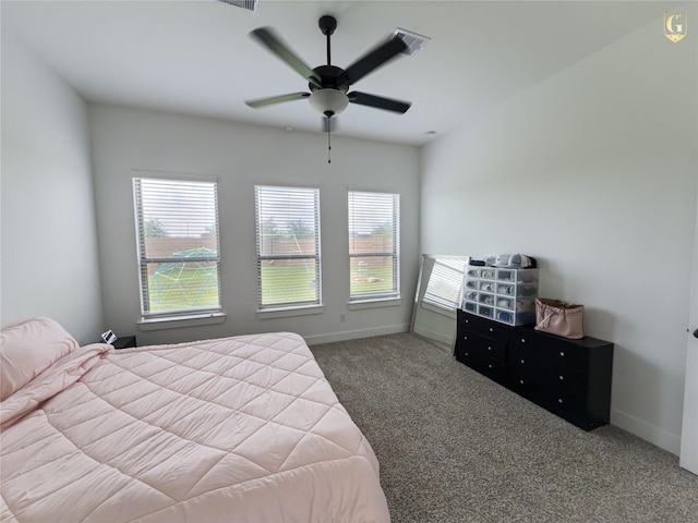 31334 Balsam Hawk Ln, Hockley, TX 77447 - carpeted bedroom featuring multiple windows, baseboards, and a ceiling fan