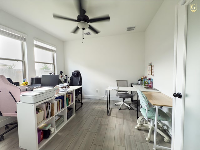 31334 Balsam Hawk Ln, Hockley, TX 77447 - home office with baseboards, a ceiling fan, and wood finished floors
