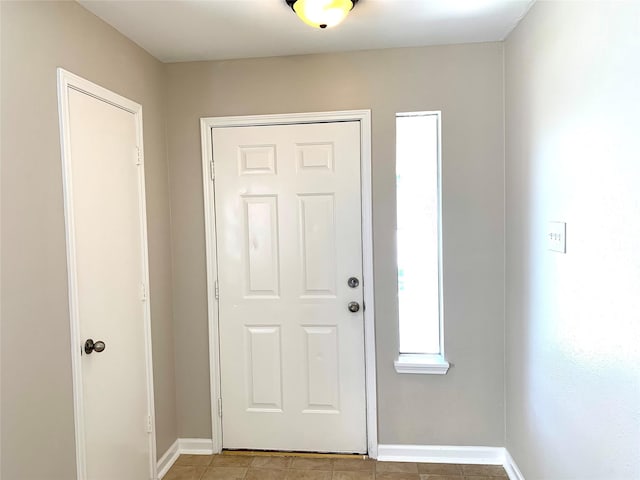 7302 River Pines Dr, Cypress, TX 77433 - foyer featuring baseboards and light tile patterned flooring
