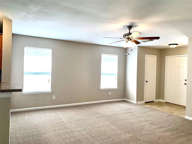 7302 River Pines Dr, Cypress, TX 77433 - spare room with carpet flooring, a ceiling fan, and baseboards