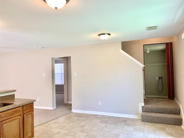 7302 River Pines Dr, Cypress, TX 77433 - unfurnished living room featuring stairway, baseboards, and light carpet