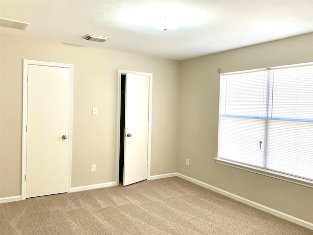 7302 River Pines Dr, Cypress, TX 77433 - unfurnished bedroom with light carpet and baseboards