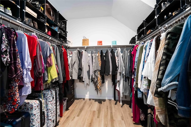 8414 Bay Ridge Cir, Baytown, TX 77523 - walk in closet with vaulted ceiling and wood finished floors